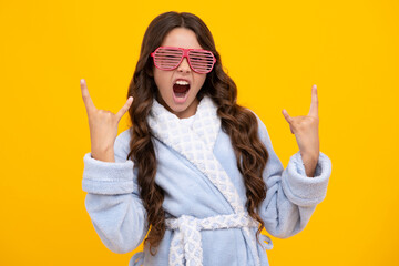 Amazed teen girl. Portrait of teenage girl in funny glasses and pajama or home bathrobe feeling fun. Kids pajama party. Excited expression, cheerful and glad. - obrazy, fototapety, plakaty