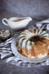 Breakfast pudding. Chocolate coffee milk jelly cake for dessert. Sweet food on the table. Still life. Grey background