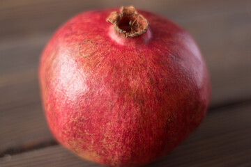 Fototapeta na wymiar Red fresh juicy pomegranate. Bokeh