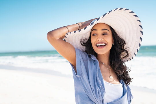 Happy stylish woman enjoy the beach with copy space
