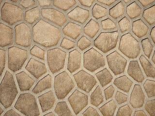 interesting network stone wall texture with an appearance like gold in the distance