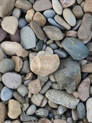 pebble stones on a riverbank background, spain