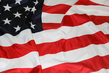 The flag of the United States, folded in waves. Flag Day. The concept of Independence Day, elections, Memorial Day. 