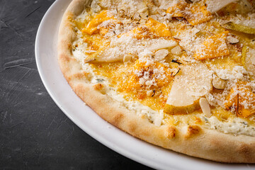 hot delicious traditional italian pizza on a dark stone background