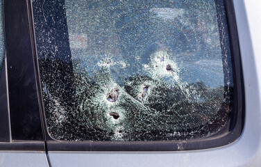 Car riddled with bullets. War of Russia against Ukraine. A car of civilians shot by the Russian...