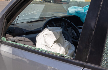 Traces of shots on the body of the car. War between Russia and Ukraine. Part of a civilian car that...