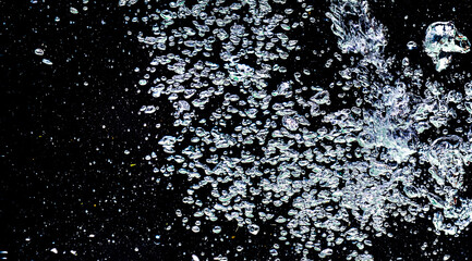 Studio shot bubbles in water on black background. Abstract Background Concept