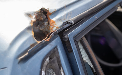 Car riddled with bullets. War of Russia against Ukraine. A car of civilians shot by the Russian...