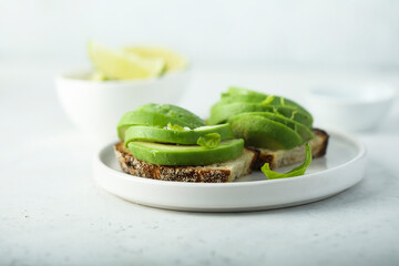 Homemade avocado toast with fresh lime