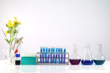 Concept of research and development of science laboratories microscope with test tube on the table and white background