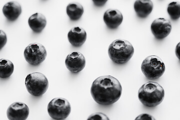 Close up view of fresh blueberries on white background.
