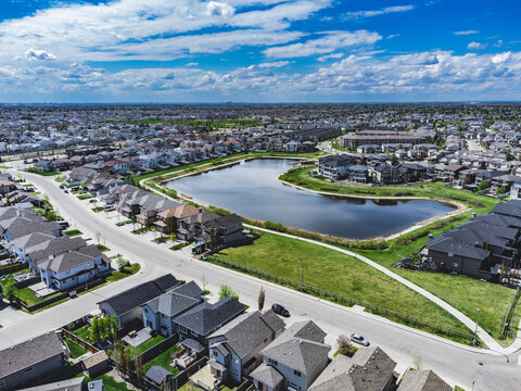 Aerial shot of Edmonton, Alberta, Canada.  Stormwater pond.  Green space.  View for distance.  