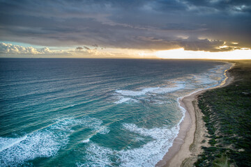 Fototapeta na wymiar Drone view of waves along the coast at Point Lonsdale, Victoria, Australia. May 2022