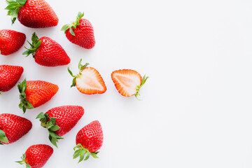 Obraz na płótnie Canvas Top view of juicy strawberries on white background.