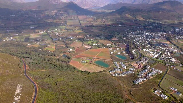 Franschhoek pass overlooking scenic town in fertile wine valley