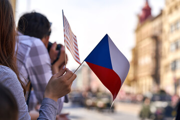 People waving Czech and American flags at the Liberation festival or Slavnosti svobody in Pilsen