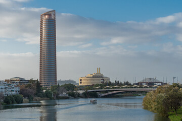 View of Torre Sevilla, tallest building in Andalucia from Triana bridge, Seville, Spain