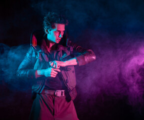 A guy in a cyberpunk image, pulls out a gun. a futuristic character. A young man in neon lighting...
