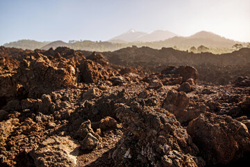 Volcanic landscape. Black rocky texture of cooled lava in Teide national park, Tenerife.