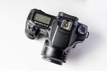 Professional dslr camera equipment with 50 mm f1.8 prime lens objective camera lens in macro close-up view shows details of photographic equipment for studio shots and portrait photography with dslr