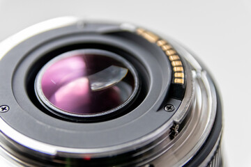 Back side of a dslr camera lens objective for professional photography with camera mount details in...
