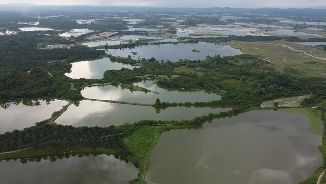 Aerial view reflection at abandoned tin mining lake at Kampar, Perak
