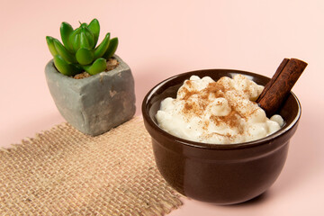 traditional sweet from the Brazilian June festivals, made of white corn with coconut and condensed milk and sprinkled with cinnamon