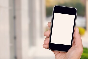 Hand holds phone Sample social media app interface on mobile phone showing shared video content