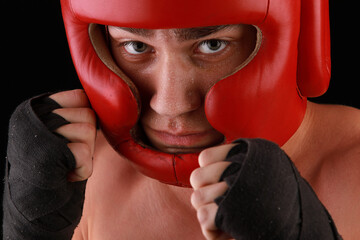 boxer in a protective helmet for boxing
