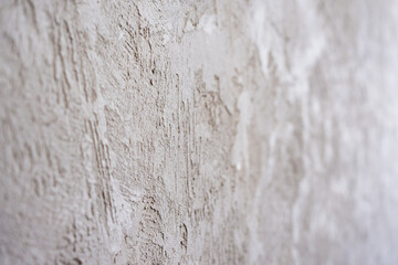 artistic plaster on a gray and white wall. Repairs. elements of wall decor. copy space. texture. background.