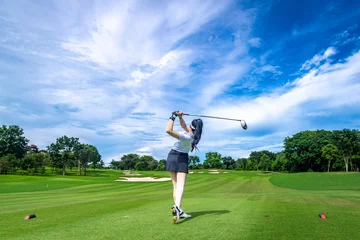 Fototapeten Professional woman golfer teeing golf in golf tournament competition at golf course for winner   © APstudio