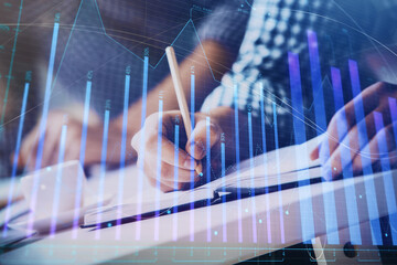 Multi exposure of two men planing investment with stock market forex chart.