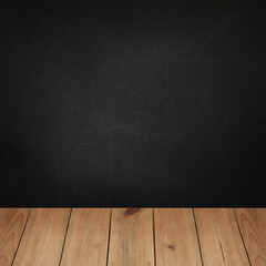 Wooden table top with concrete blackboard wall background for product placement