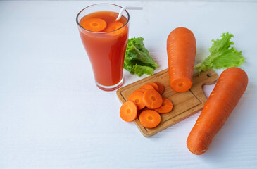 Healthy fresh carrot juice on the white table