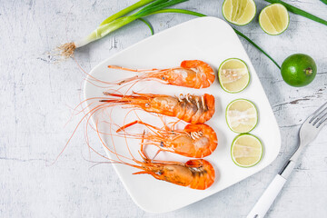 Seafood shrimp menu in a plate on a white table