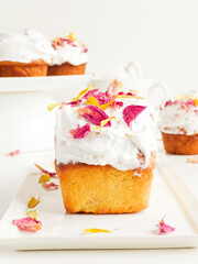 Cake with edible flowers and whipped cream. Shallow dof .