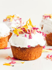 Cake with edible flowers and whipped cream. Shallow dof .