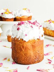 Cake with edible flowers and whipped cream. Shallow dof .