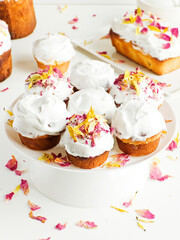 Cake with edible flowers and whipped cream. Shallow dof .