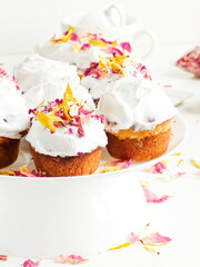 Cake with edible flowers and whipped cream. Shallow dof .
