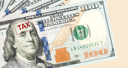 Obraz na płótnie Canvas Hundred US dollar bills background border and tax closeup