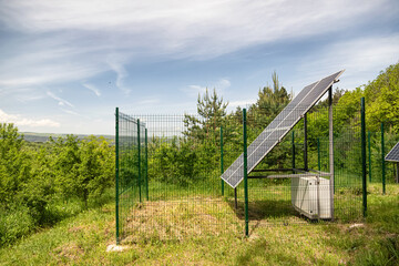 Large solar panel installed in a park area among the forest