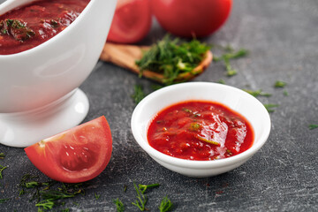 Closeup on portion of tomato sauce on grey background