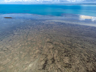Obraz premium Amazing coral reef in the middle of the sea in Porto Seguro, Bahia, Brazil - natural beauty aerial drone view