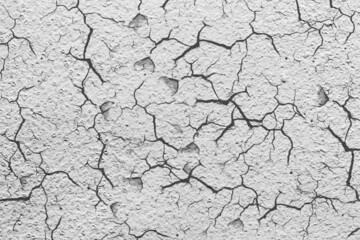 Texture crack building facade wall covered. Crack with flappy peeling edges.