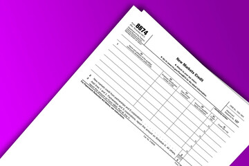 Form 8874 documentation published IRS USA 44207. American tax document on colored