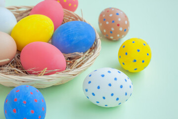 Fototapeta na wymiar Colorful eggs on green background