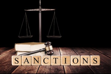 Classic judge's gavel with wooden cubes for the text with Russian flag, Concept on the of sanctions...