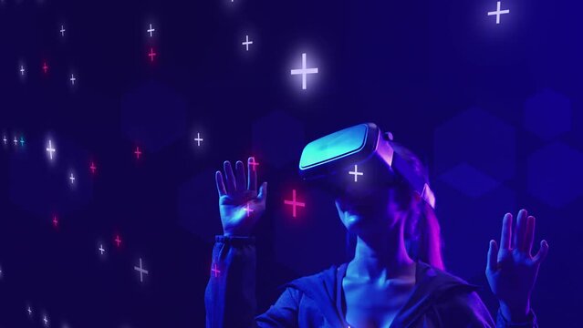 Teenager female playing VR virtual reality metaverse MR mixed reality game wearing VR goggle watching virtual cyberspace futuristic abstract digit number digital technology backgrounds