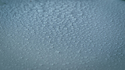 Abstract picture of rain drops. Water drops on gray-blue background.
